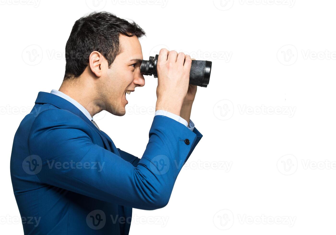 Businessman looking through binoculars photo