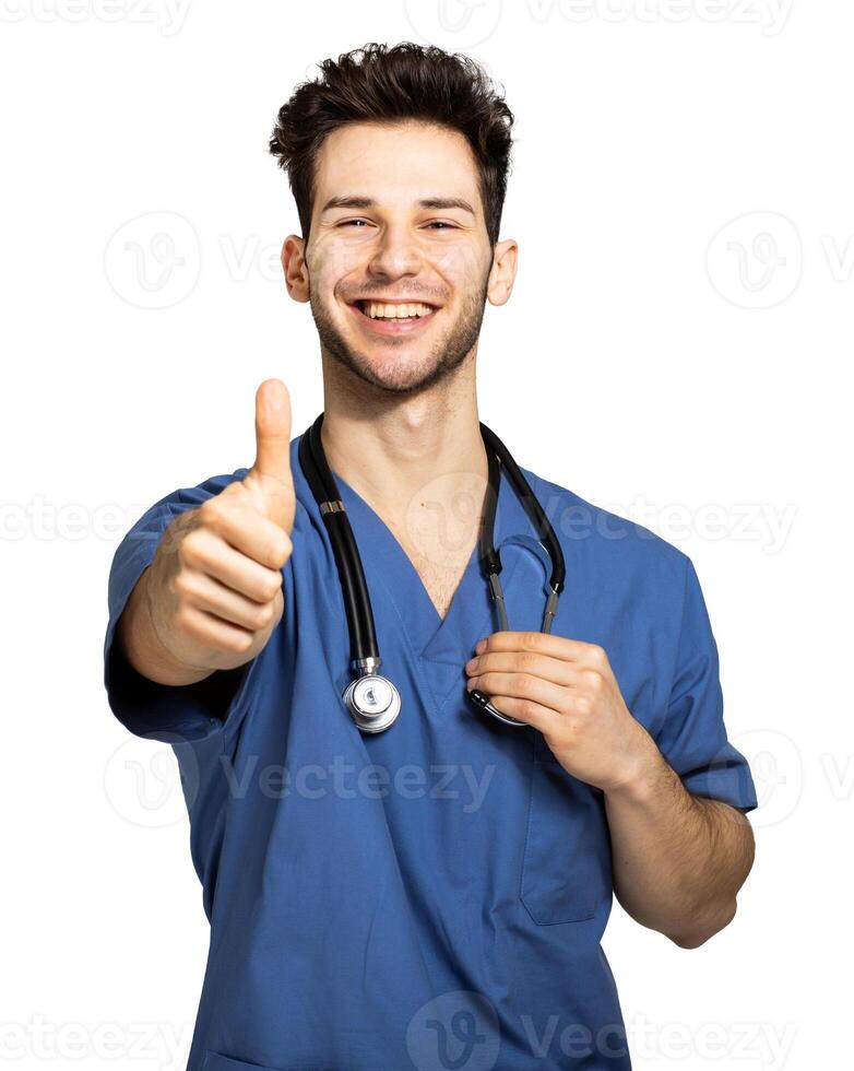 Male nurse isolated on white giving thumbs up photo