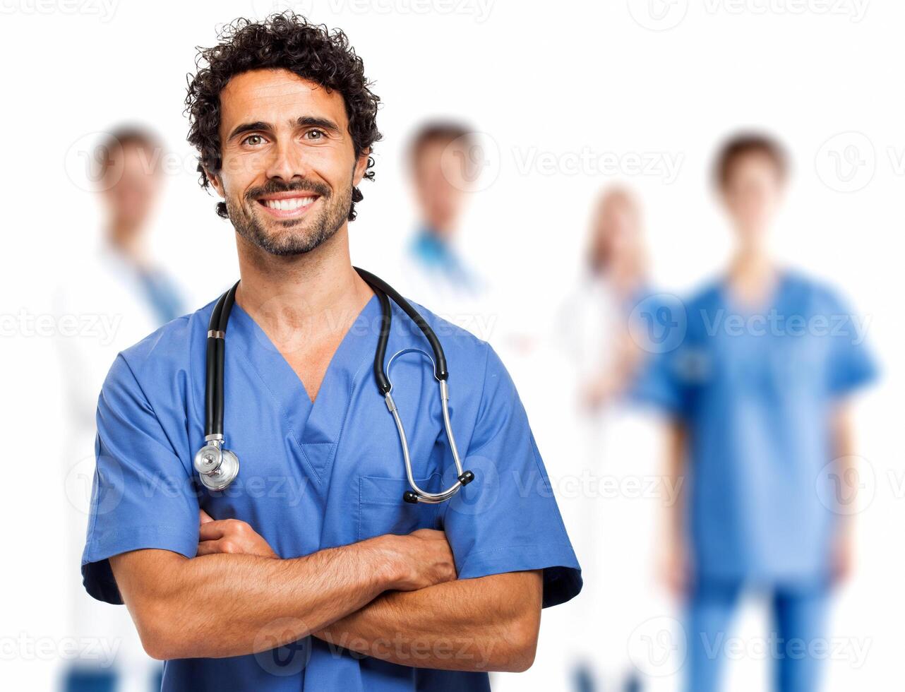 Smiling doctor in front of his team photo