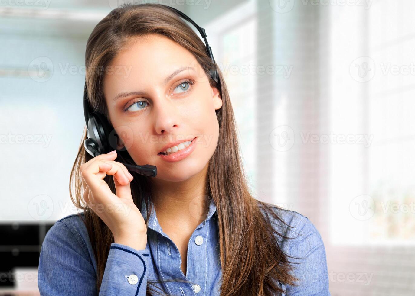 Smiling female call center operator photo