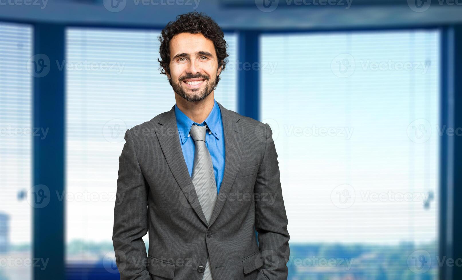 Handsome male manager in his office photo