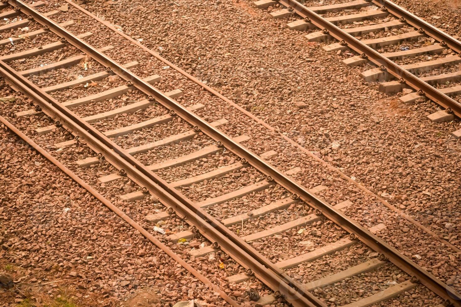 View of train Railway Tracks from the middle during daytime at Kathgodam railway station in India, Toy train track view, Indian Railway junction, Heavy industry photo