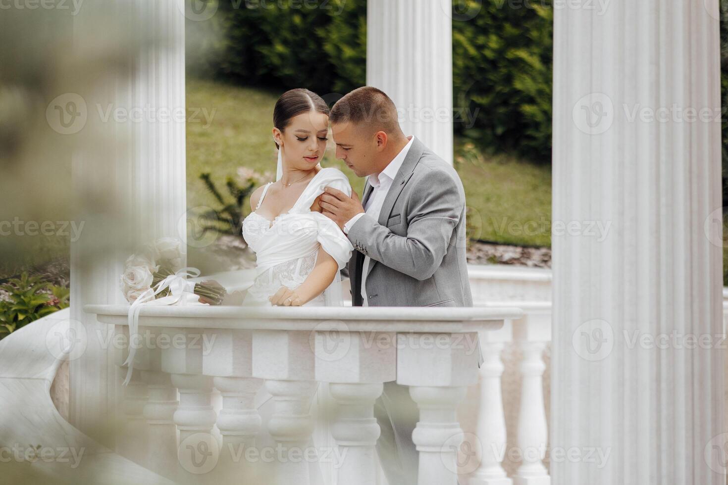 Beautiful and sensual wedding couple in the park. High quality photo. photo