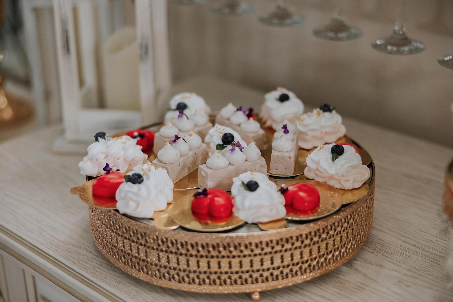 Almond cookies and various sweet cakes for a wedding banquet. A delicious reception, a luxurious ceremony. Table with sweets and desserts. Delicious colorful French desserts on a plate or table. photo