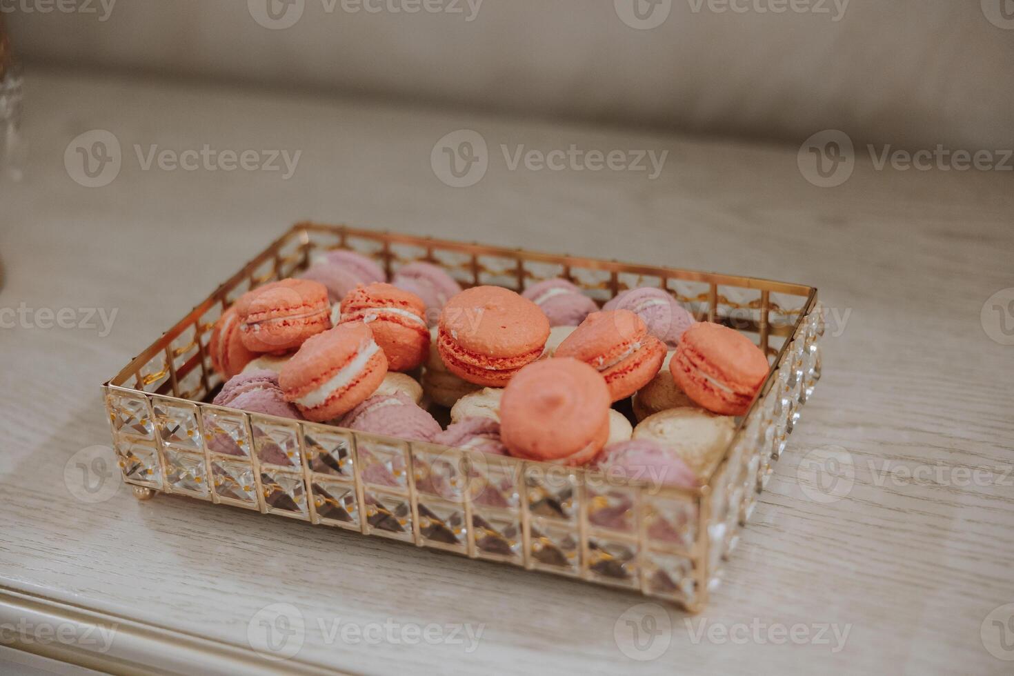 Macaroons Close-up of a candy bar at a wedding banquet. A delicious reception, a luxurious ceremony. Table with sweets and desserts. Delicious colorful French desserts on a plate or table. photo