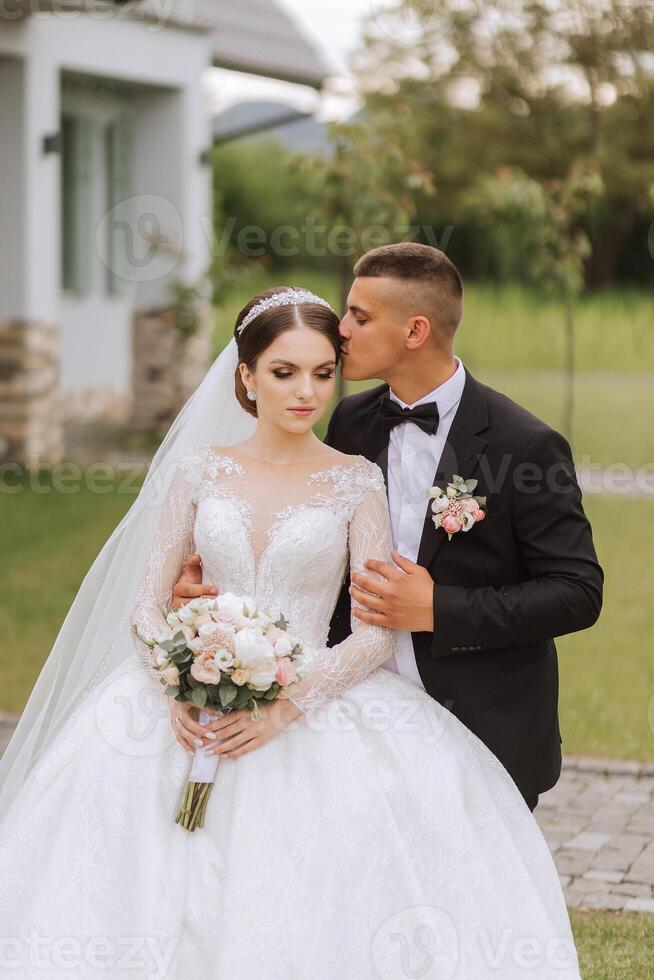 Wedding. Love and couple in garden for wedding. Celebrating the ceremony and commitment. Save the date. Trust. The bride and groom embrace. Couple in love. Wedding portrait photo