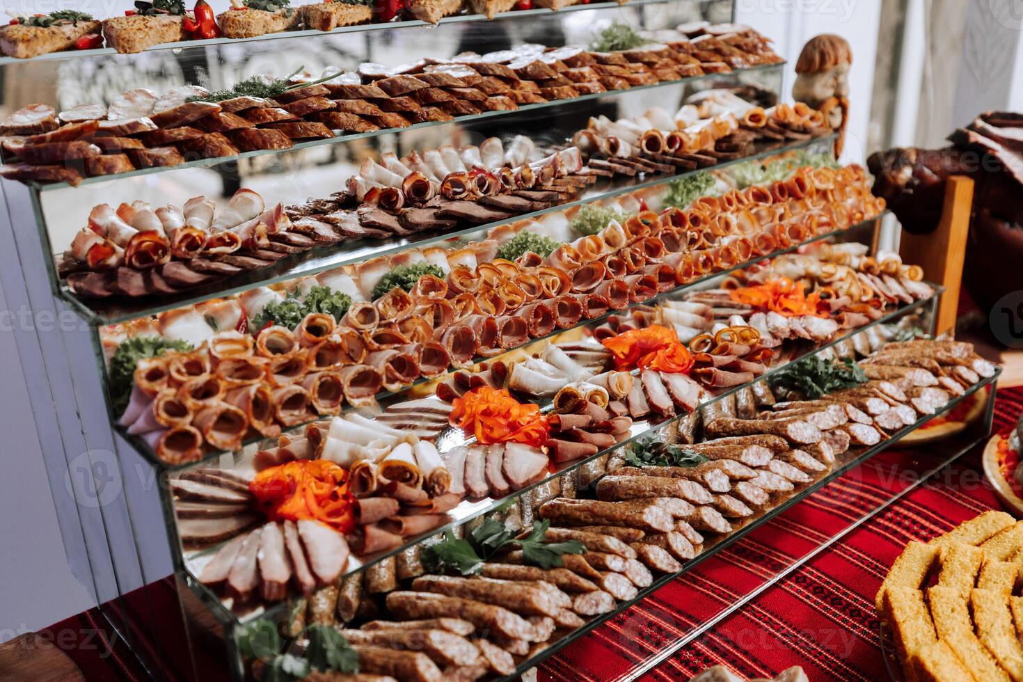 Cossack table. Banquet hall Meat treats for guests. Home-style cuts. Pork tenderloin. Delicious meat cuts. photo