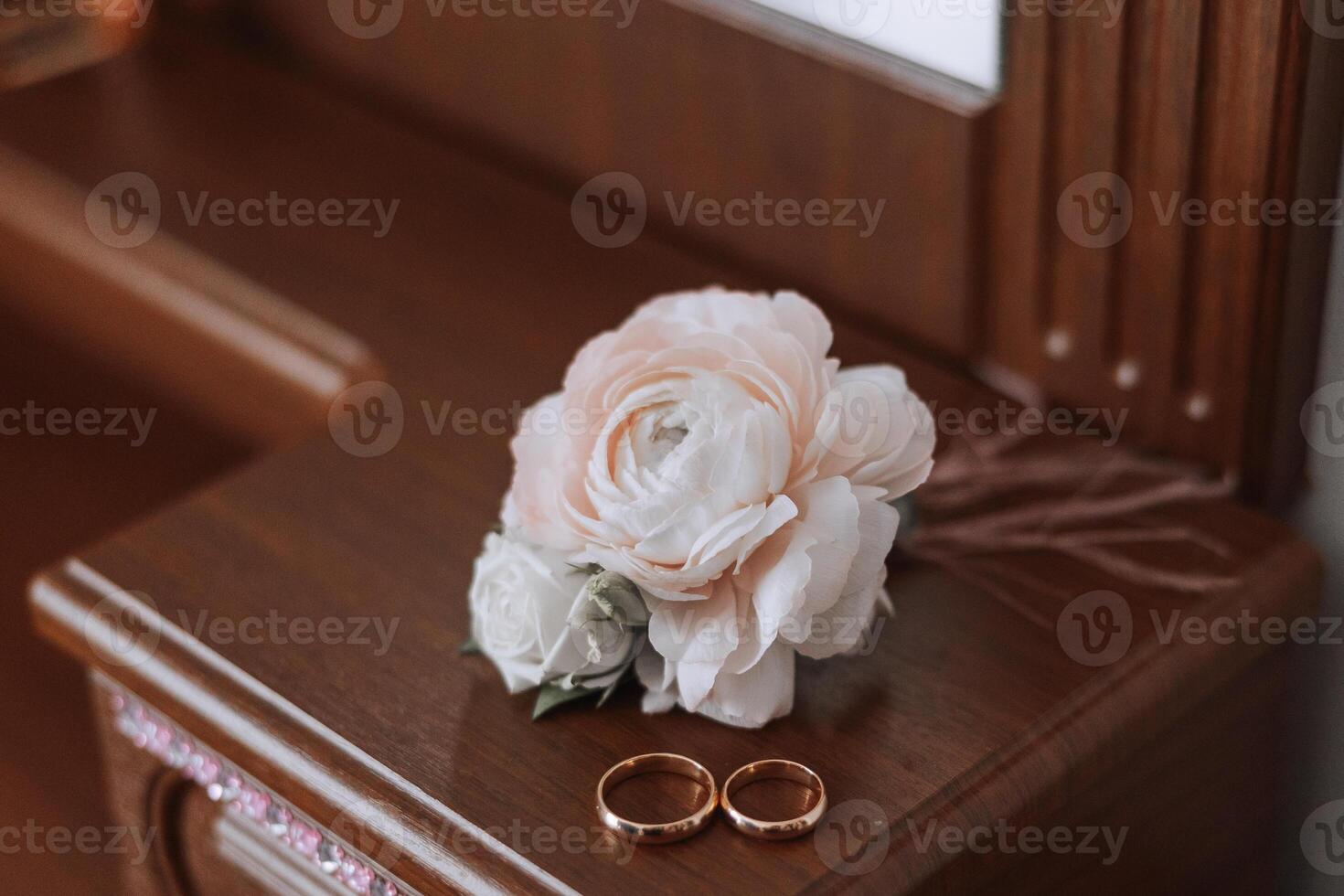 Details of the bride. Beauty is in the details. High-heeled bridal shoes. Gold wedding ring with a diamond. Perfumes. Earrings Wedding in details. photo