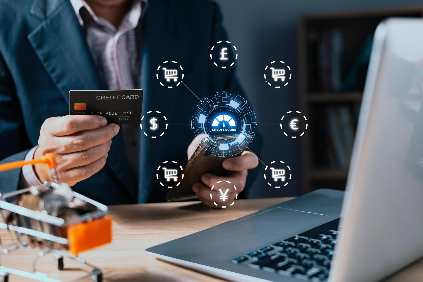 businessman hold credit card and smartphone with hologram credit report score global currency to plan in e-business, and buy or purchase produce payment online. The concept of finance and shopping. photo