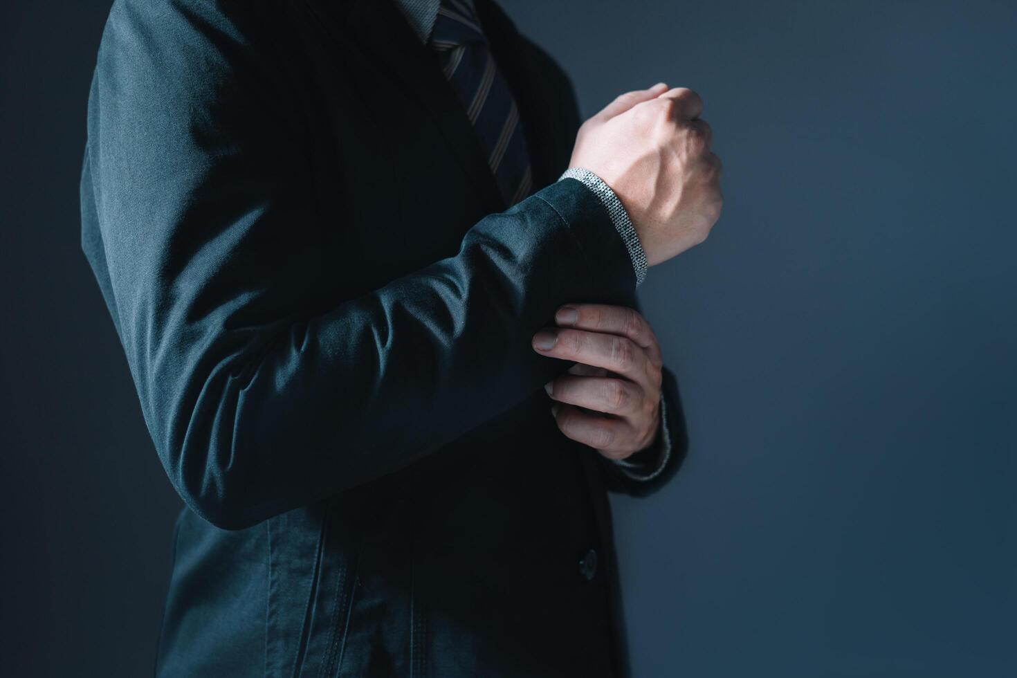 Portrait of businessman in suit standing thoughtful, half body and not showing face photo