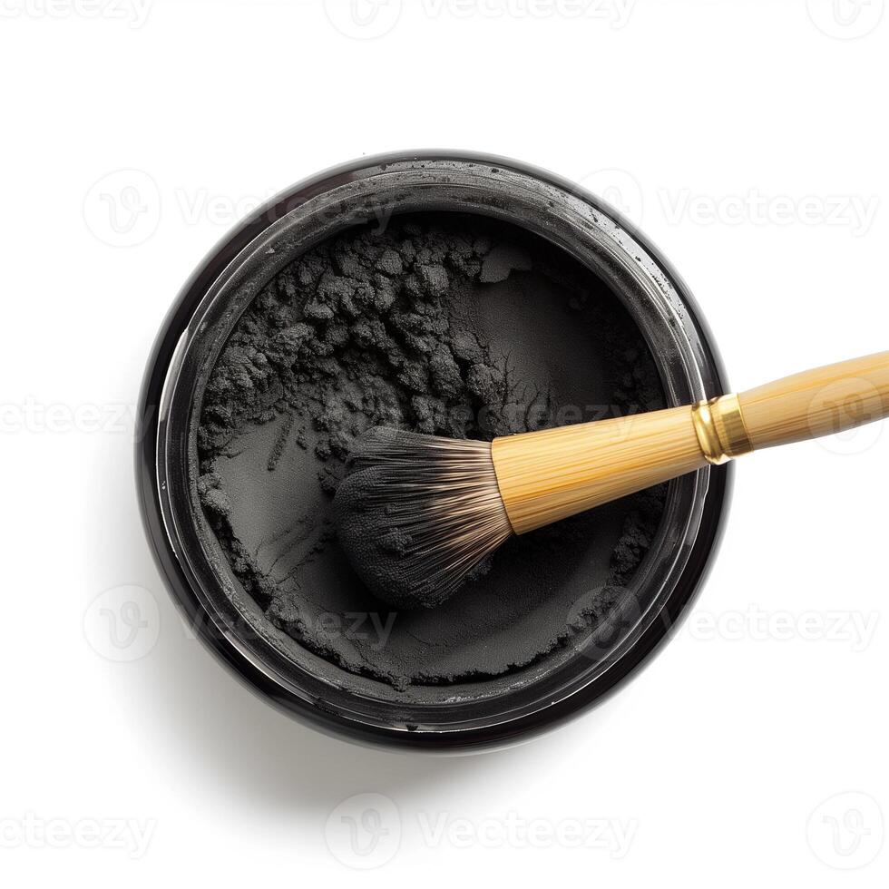 AI generated A container of activated charcoal powder with a bamboo brush top view isolated on a transparent background photo