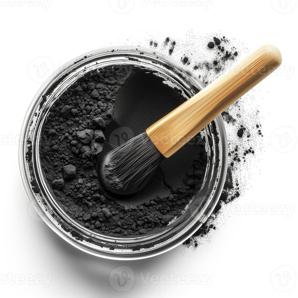 AI generated A container of activated charcoal powder with a bamboo brush top view isolated on a transparent background photo
