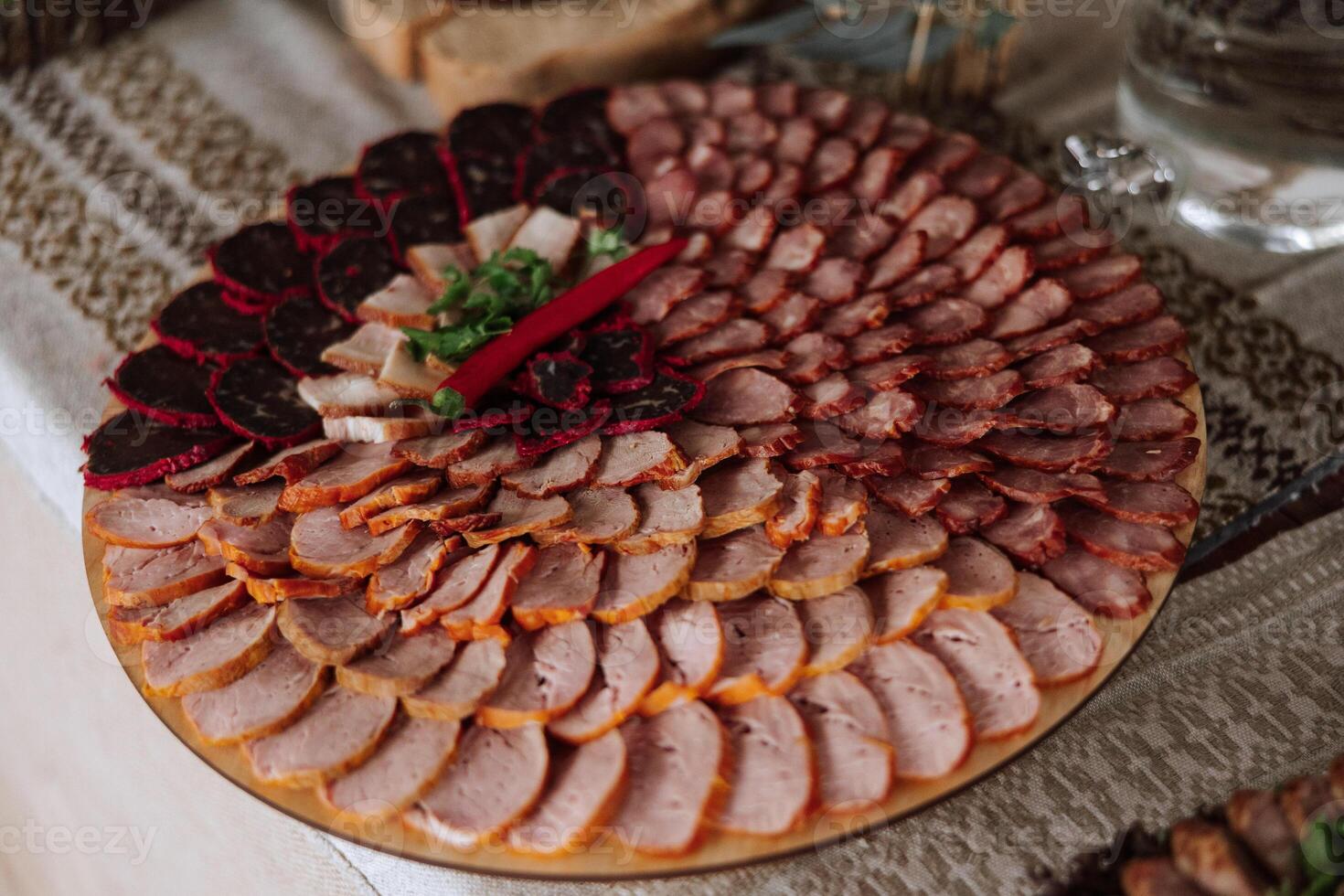 Cossack table. Banquet hall Meat treats for guests. Homemade cutouts. Pork tenderloin. Delicious meat cuts. Meat plate. Delicious compositions from smoked mint. Cottage cheese. photo