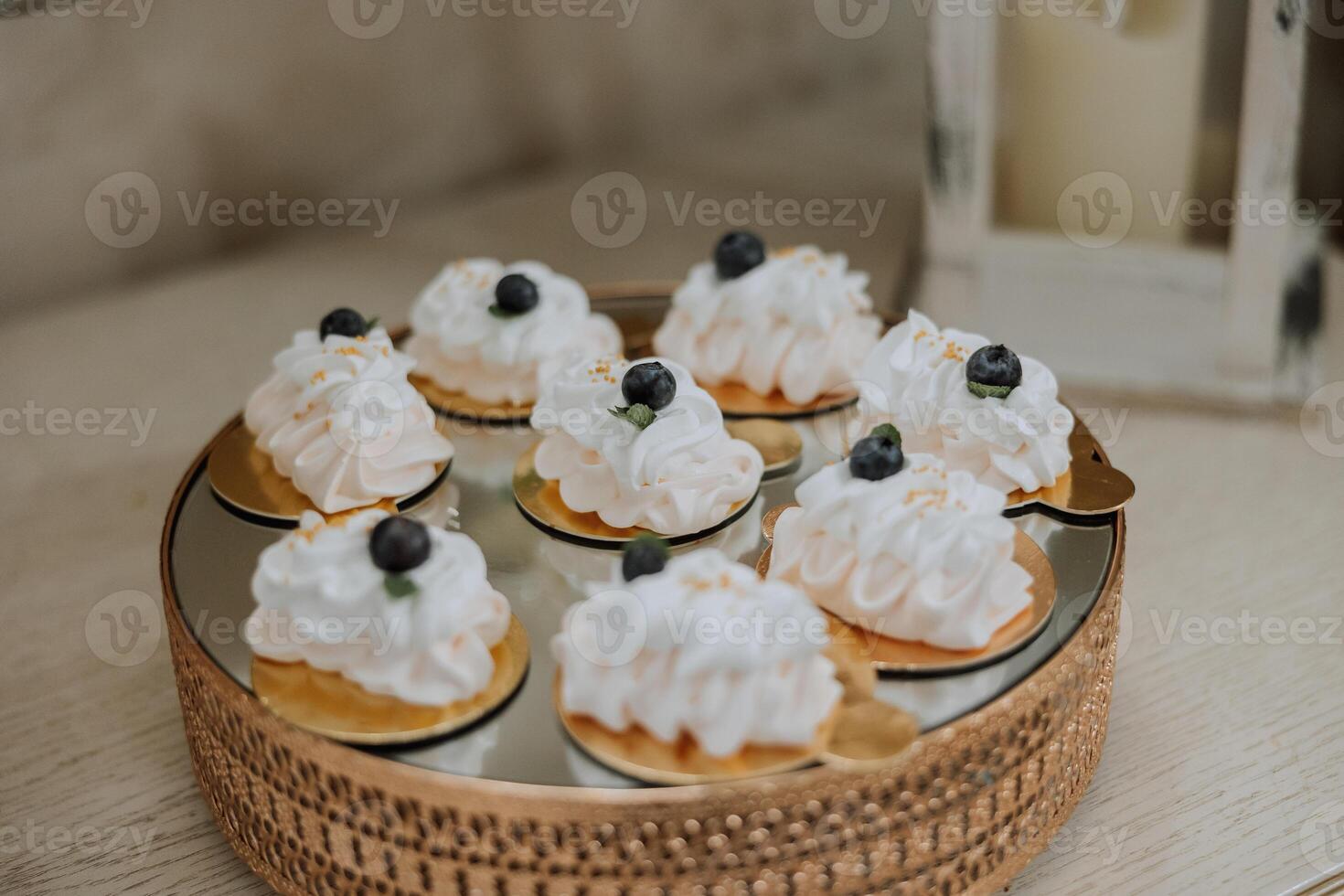 Almond cookies and various sweet cakes for a wedding banquet. A delicious reception, a luxurious ceremony. Table with sweets and desserts. Delicious colorful French desserts on a plate or table. photo