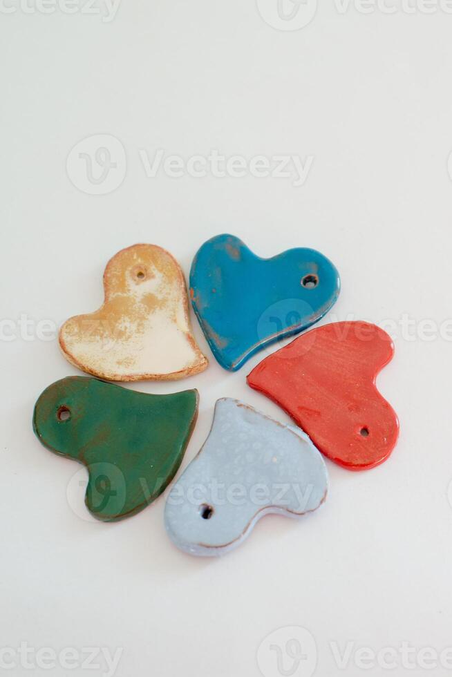 Beautiful multicolored flower made with five  small heart shaped pieces photo
