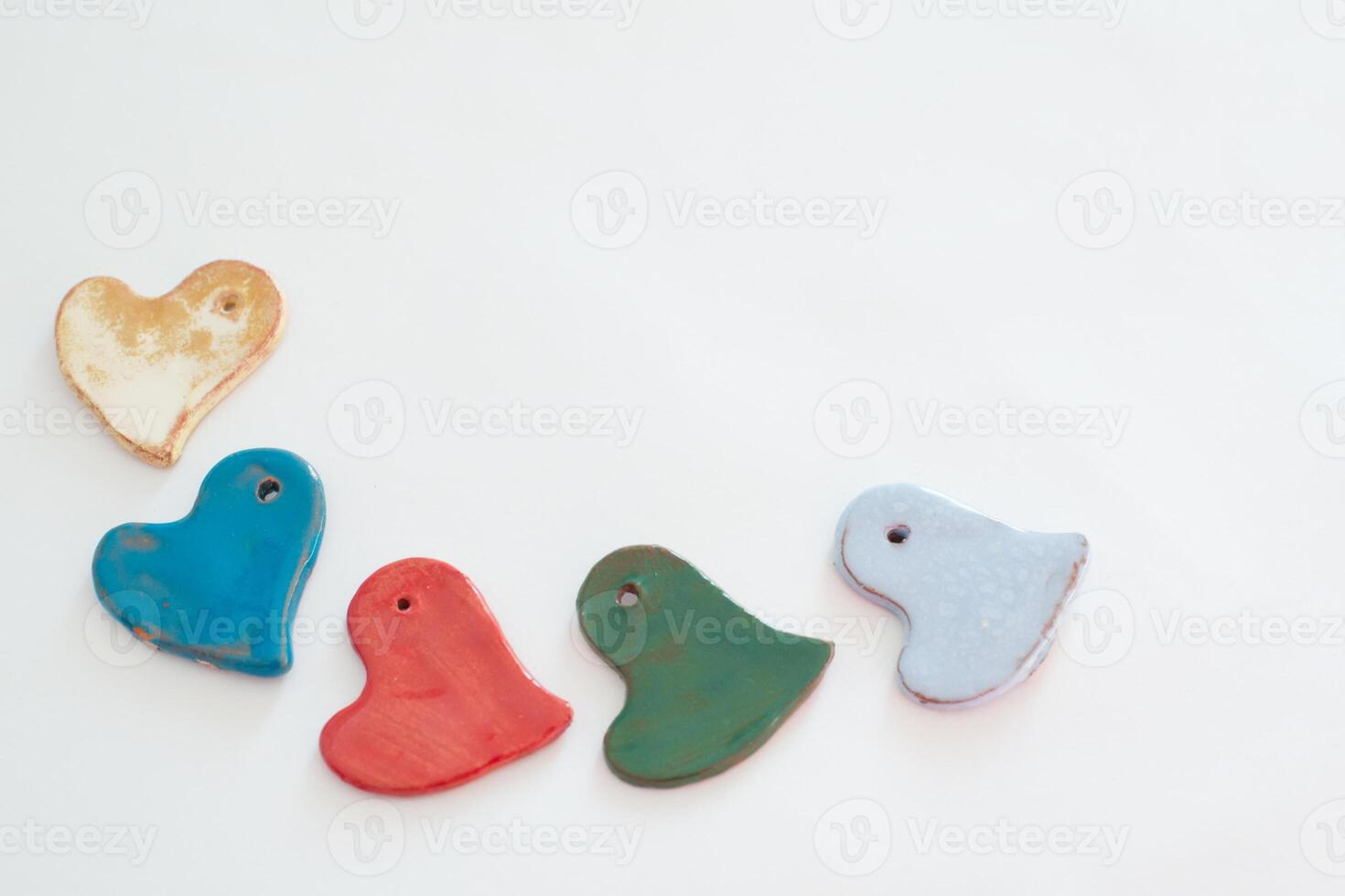 Love and diversity. Multicolored heart shaped ceramic pieces photo