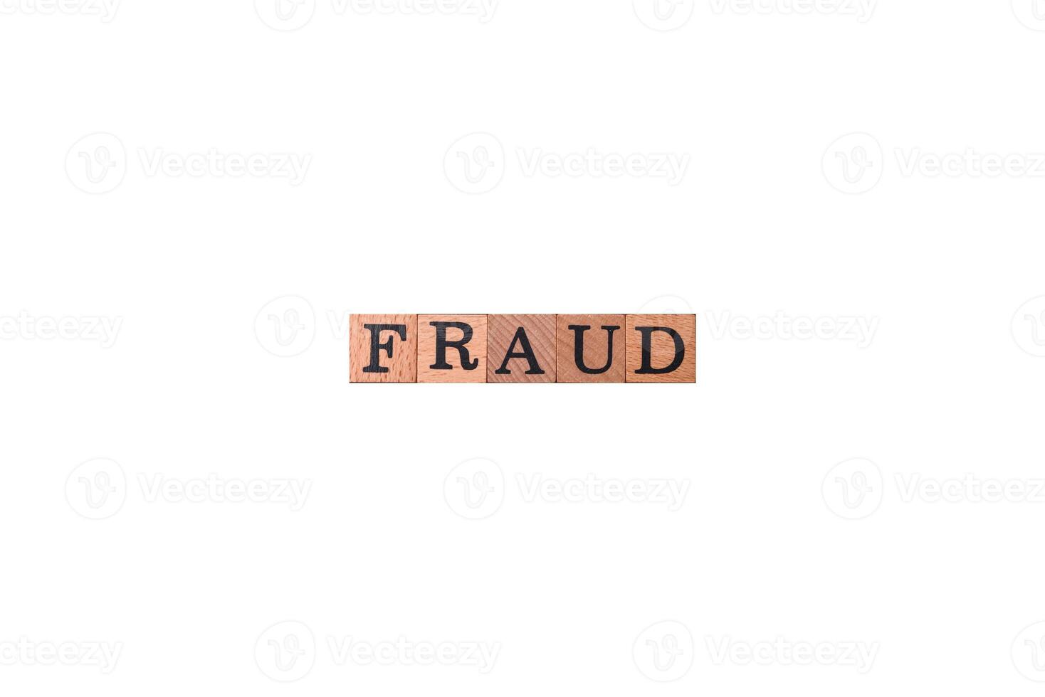 The inscription Fraud inspection made of wooden cubes on a plain background photo