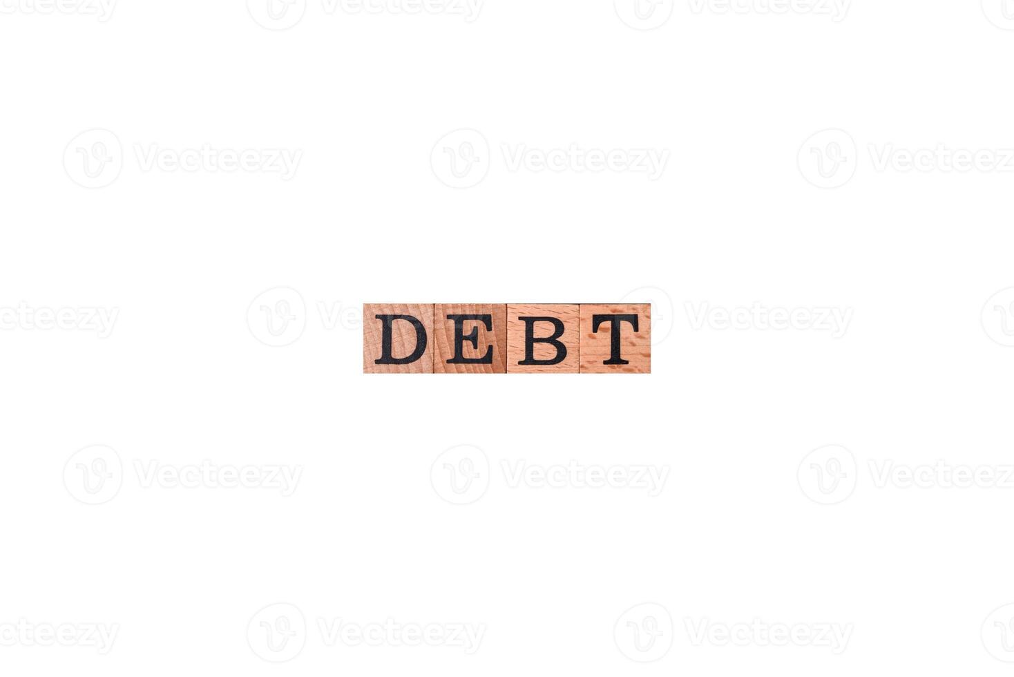 The inscription Debt inspection made of wooden cubes on a plain background photo