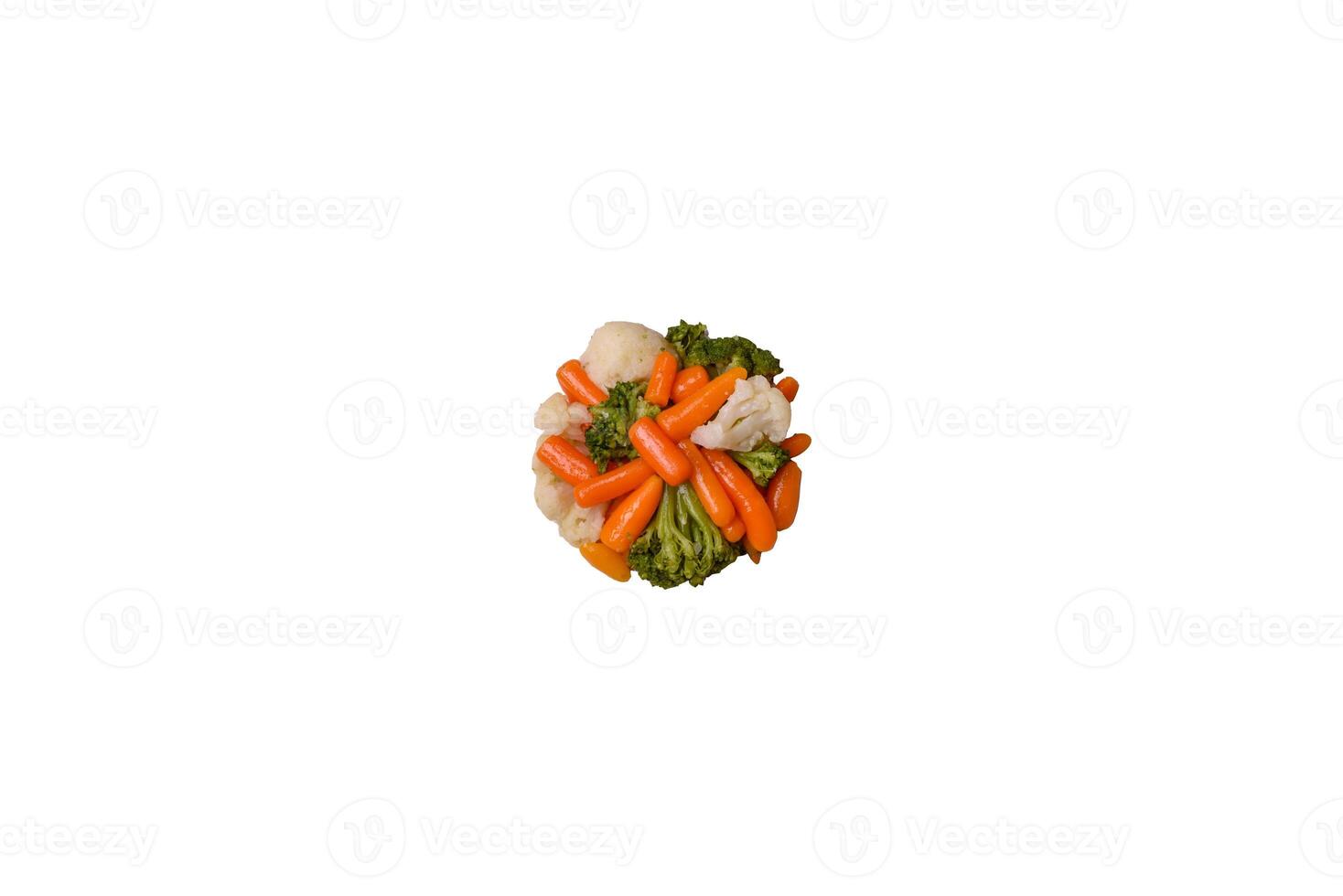Delicious fresh vegetables broccoli, cauliflower, carrots steamed with salt and spices photo