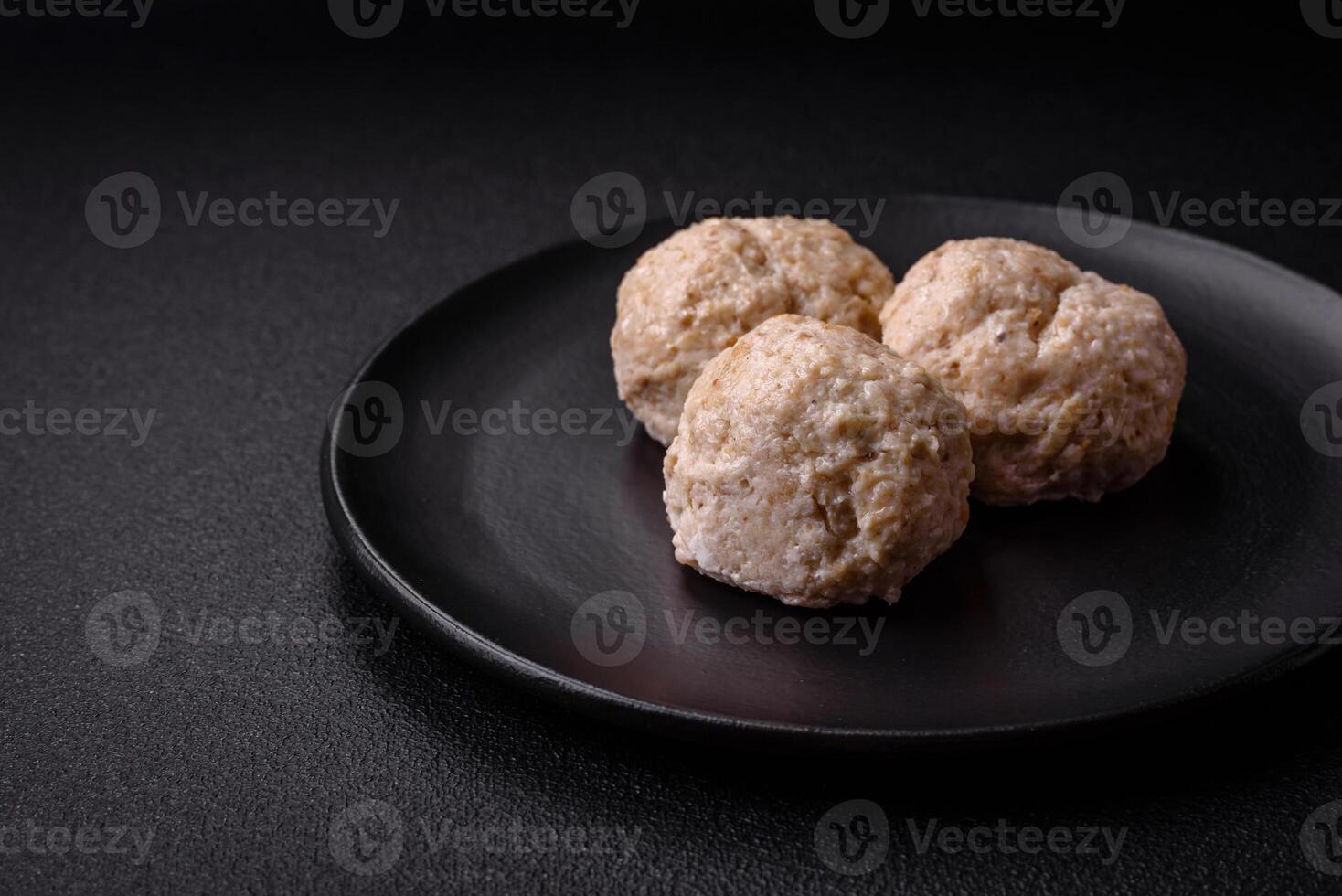 Delicious healthy steamed chicken cutlets or minced meatballs photo