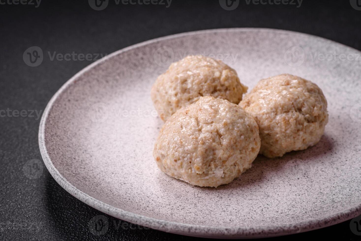 Delicious healthy steamed chicken cutlets or minced meatballs photo