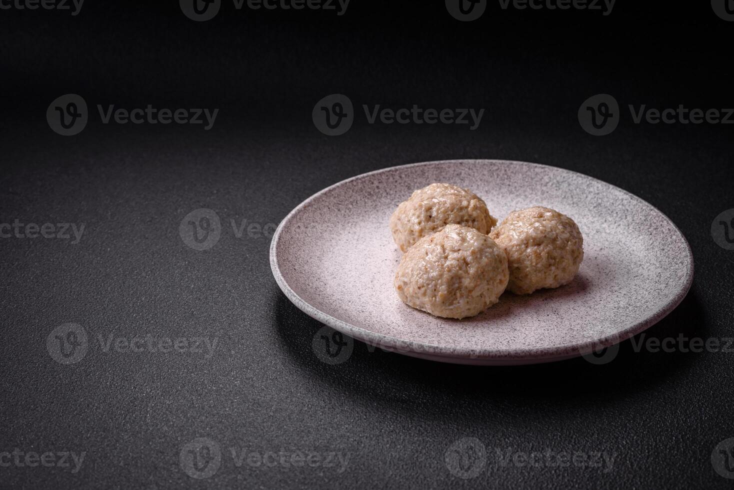 Delicious healthy steamed chicken cutlets or minced meatballs photo