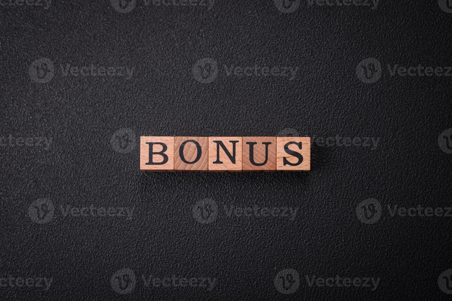 The inscription Tax made of wooden cubes on a plain background photo