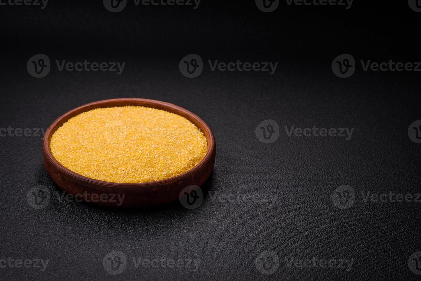 Corn grains or particles are yellow in color when raw photo