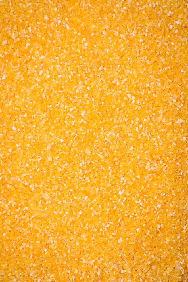 Corn grains or particles are yellow in color when raw photo