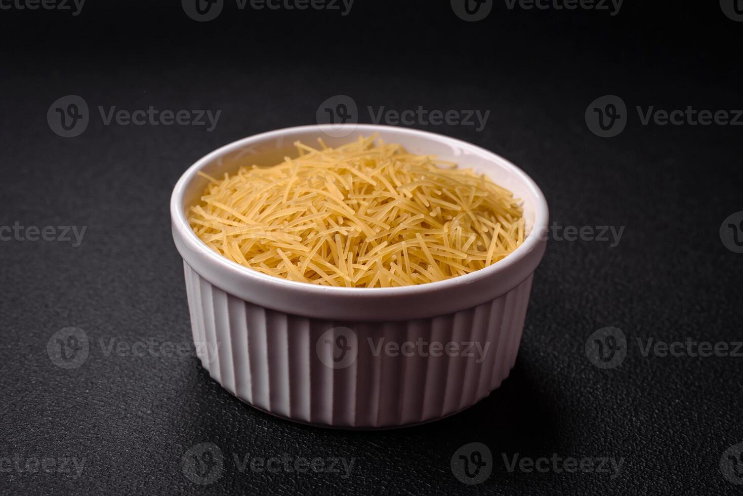 Fine vermicelli paste is yellow in color when raw photo