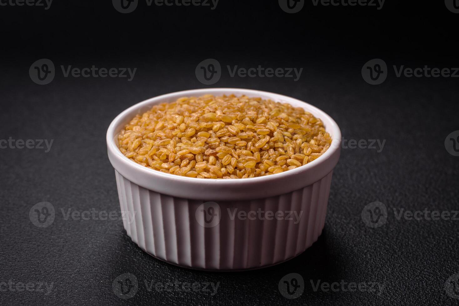 Bulgur wheat grains are yellow in color when raw photo