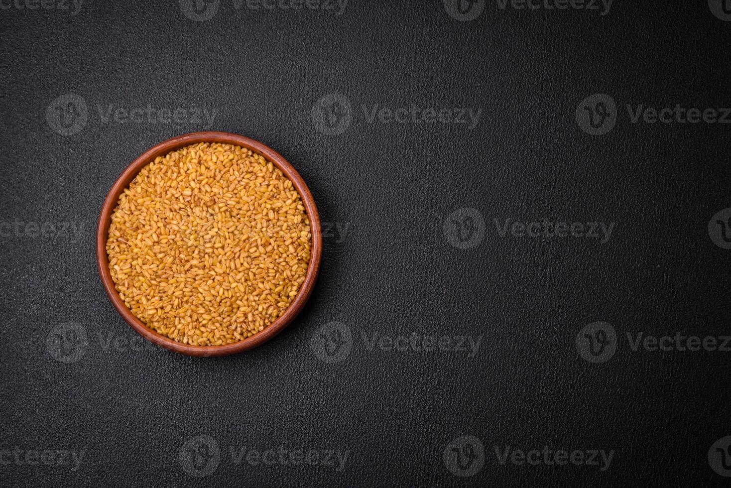 Bulgur wheat grains are yellow in color when raw photo