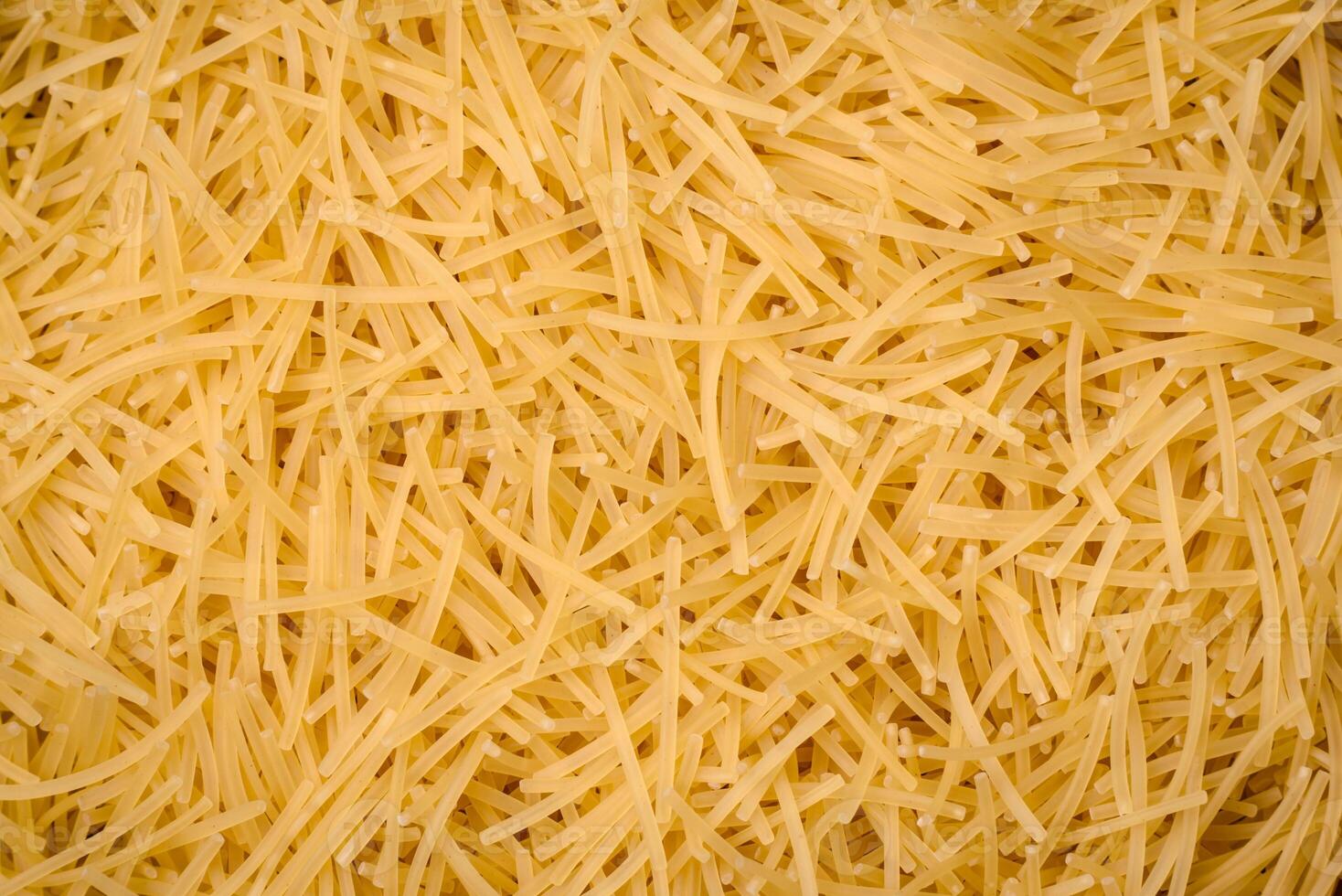 Fine vermicelli paste is yellow in color when raw photo
