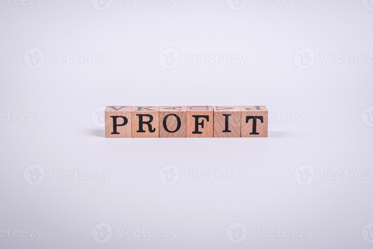 The inscription Profit inspection made of wooden cubes on a plain background photo