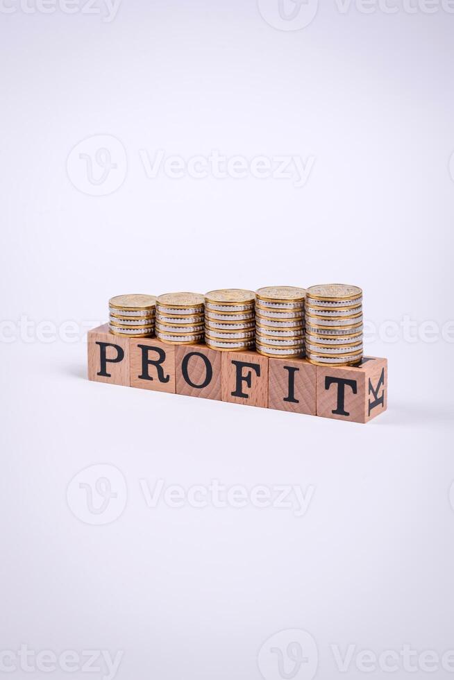 The inscription Profit inspection made of wooden cubes on a plain background photo