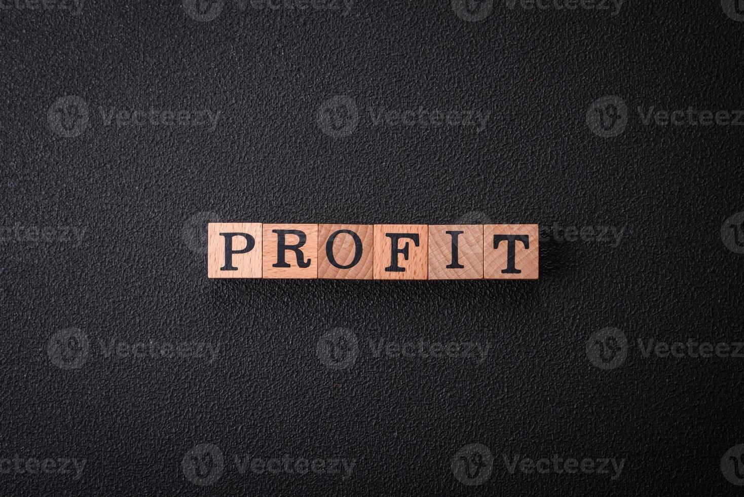 The inscription Profit inspection made of wooden cubes on a plain background photo