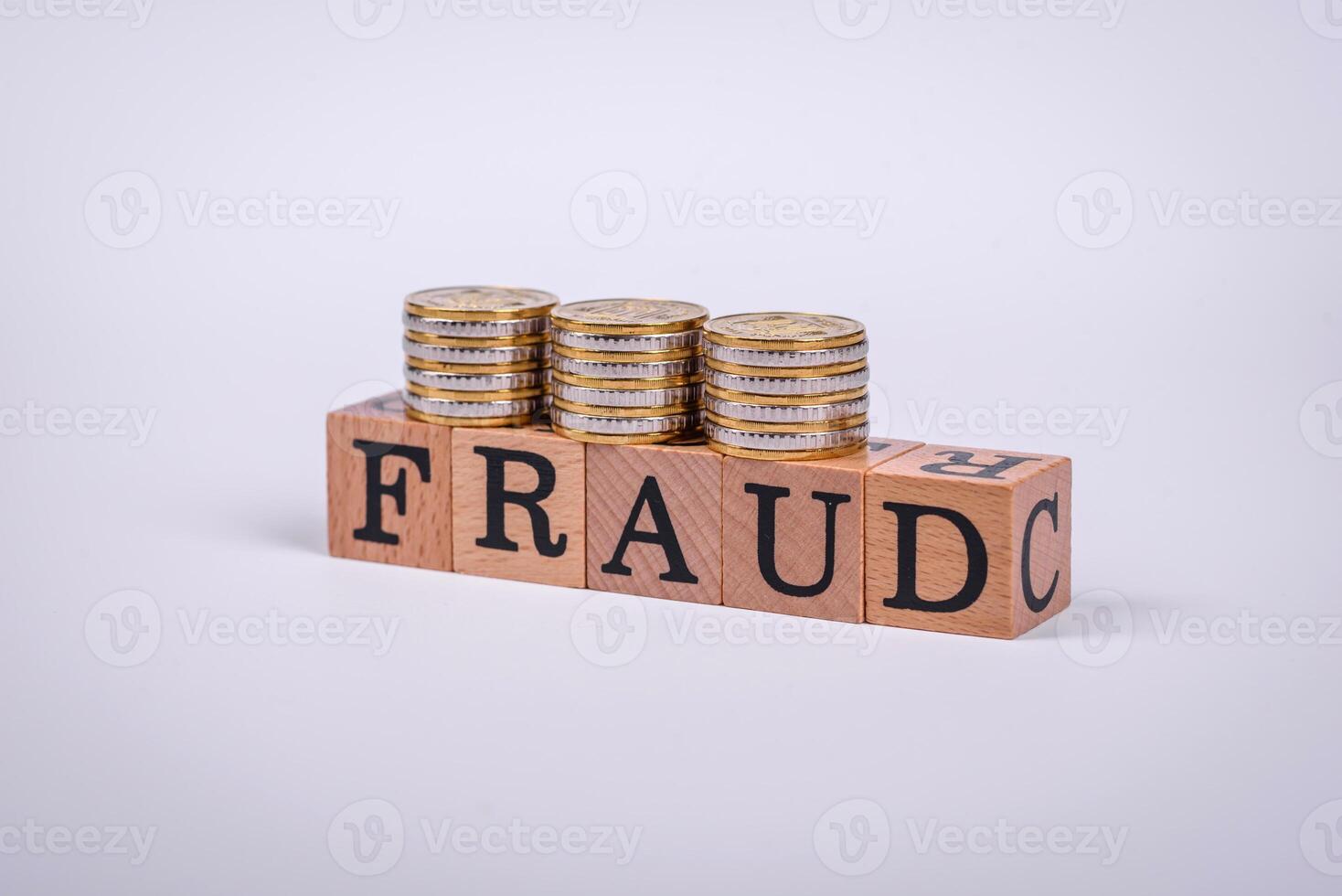 The inscription Fraud inspection made of wooden cubes on a plain background photo