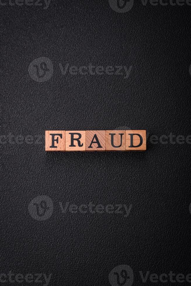 The inscription Fraud inspection made of wooden cubes on a plain background photo