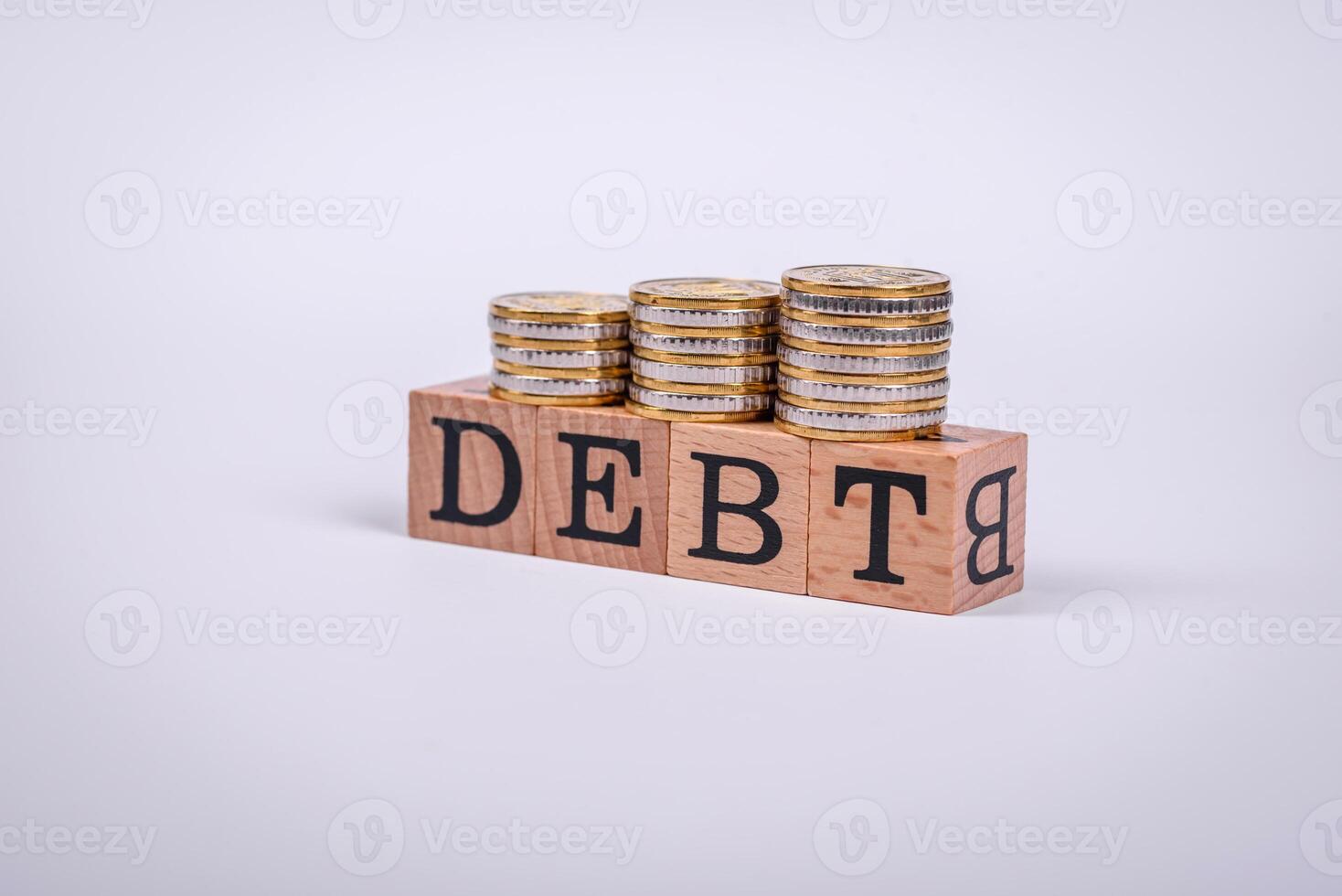 The inscription Debt inspection made of wooden cubes on a plain background photo