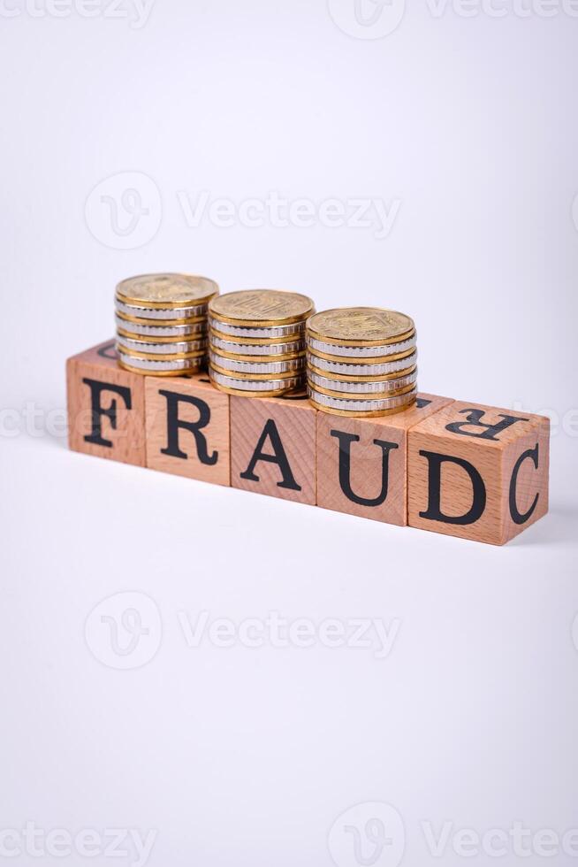 The inscription Fraud inspection made of wooden cubes on a plain background photo