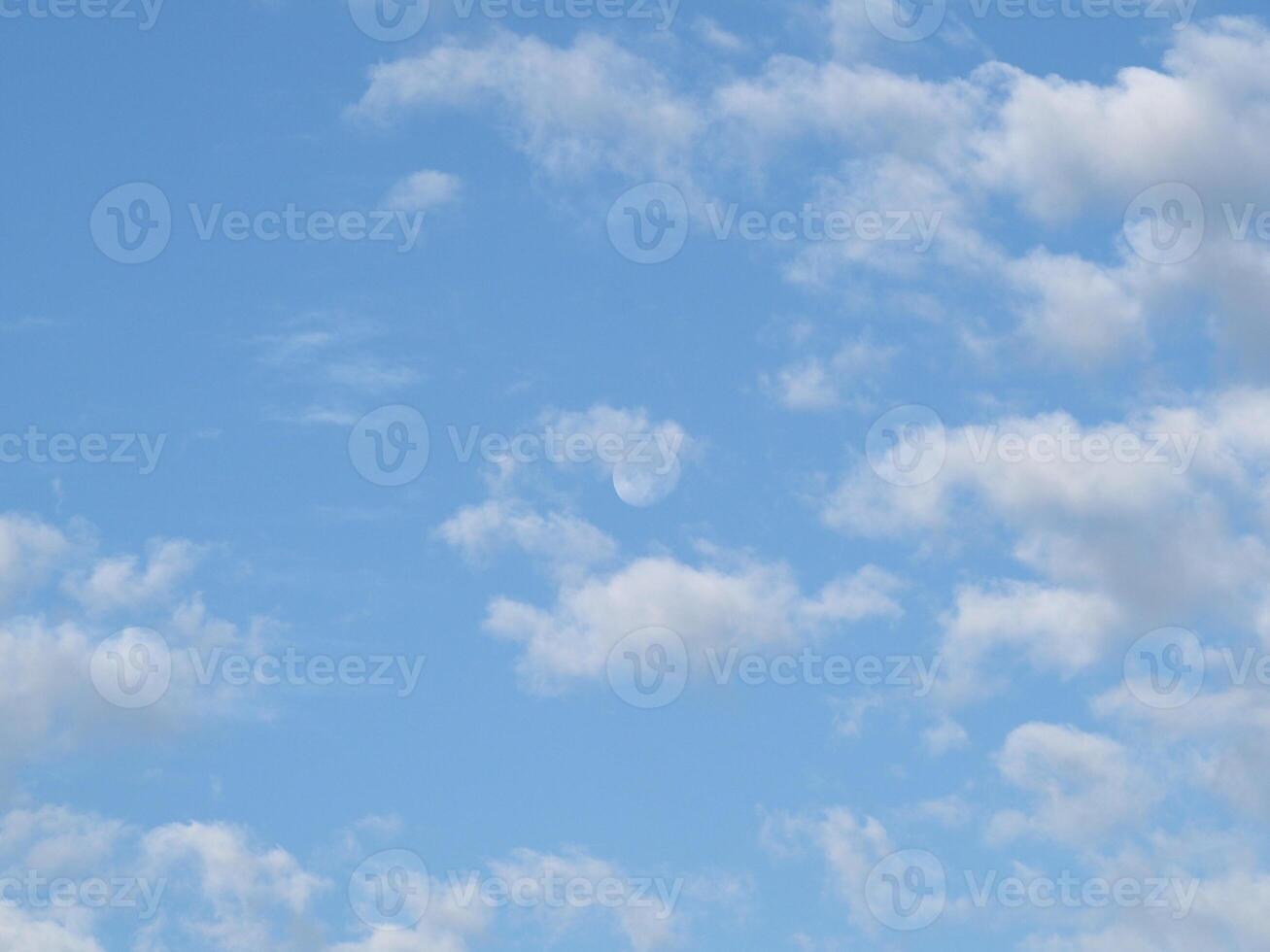 cloudy blue sky with moon background photo