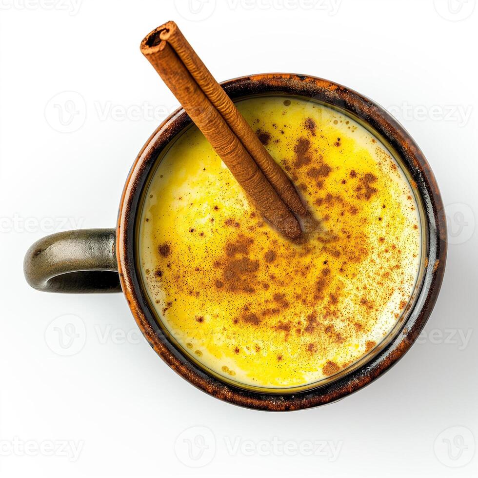 AI generated A ceramic mug of golden milk turmeric latte with a cinnamon stick top view isolated on a transparent background photo