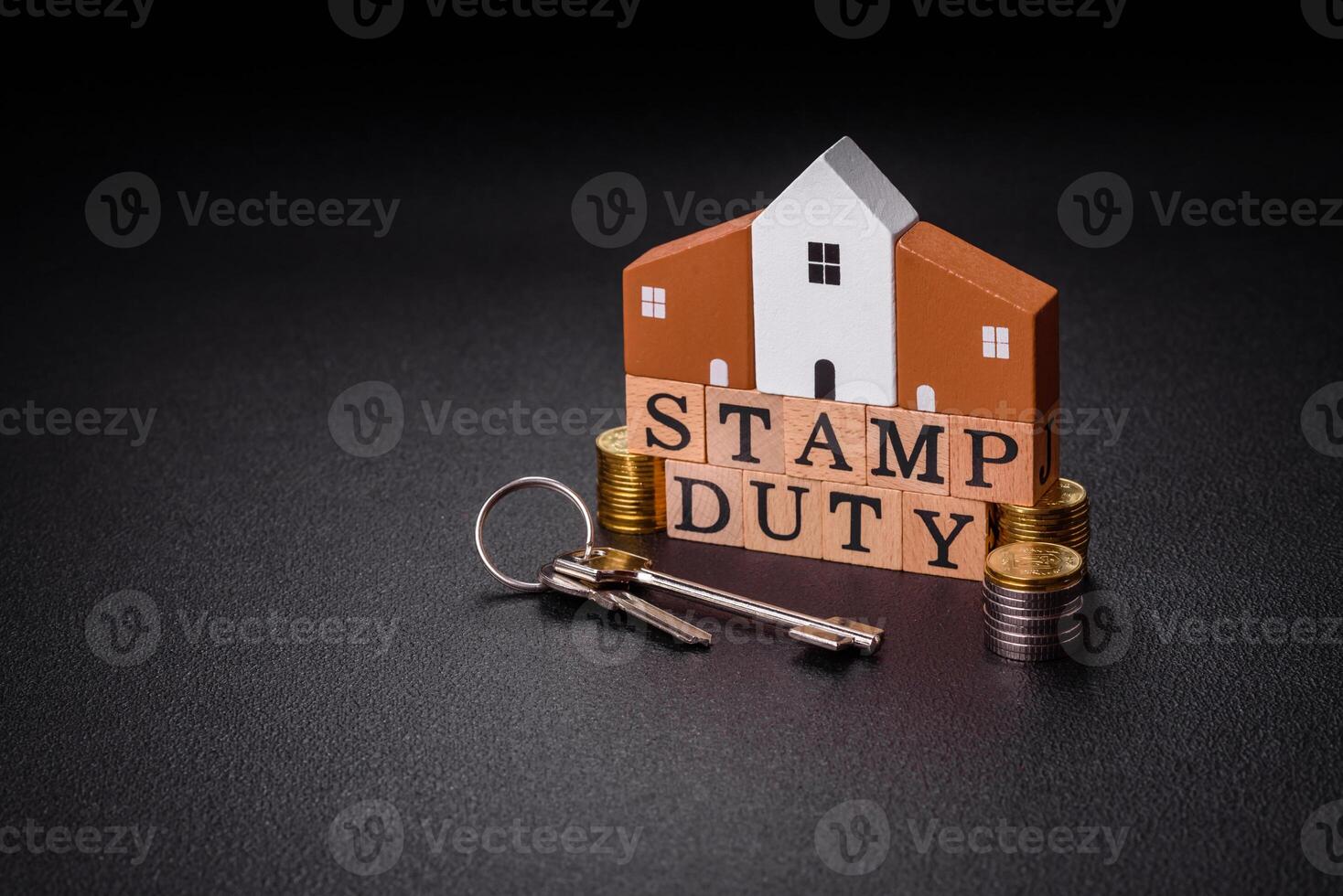 The inscription Stamp Duty made of wooden cubes on a plain background photo