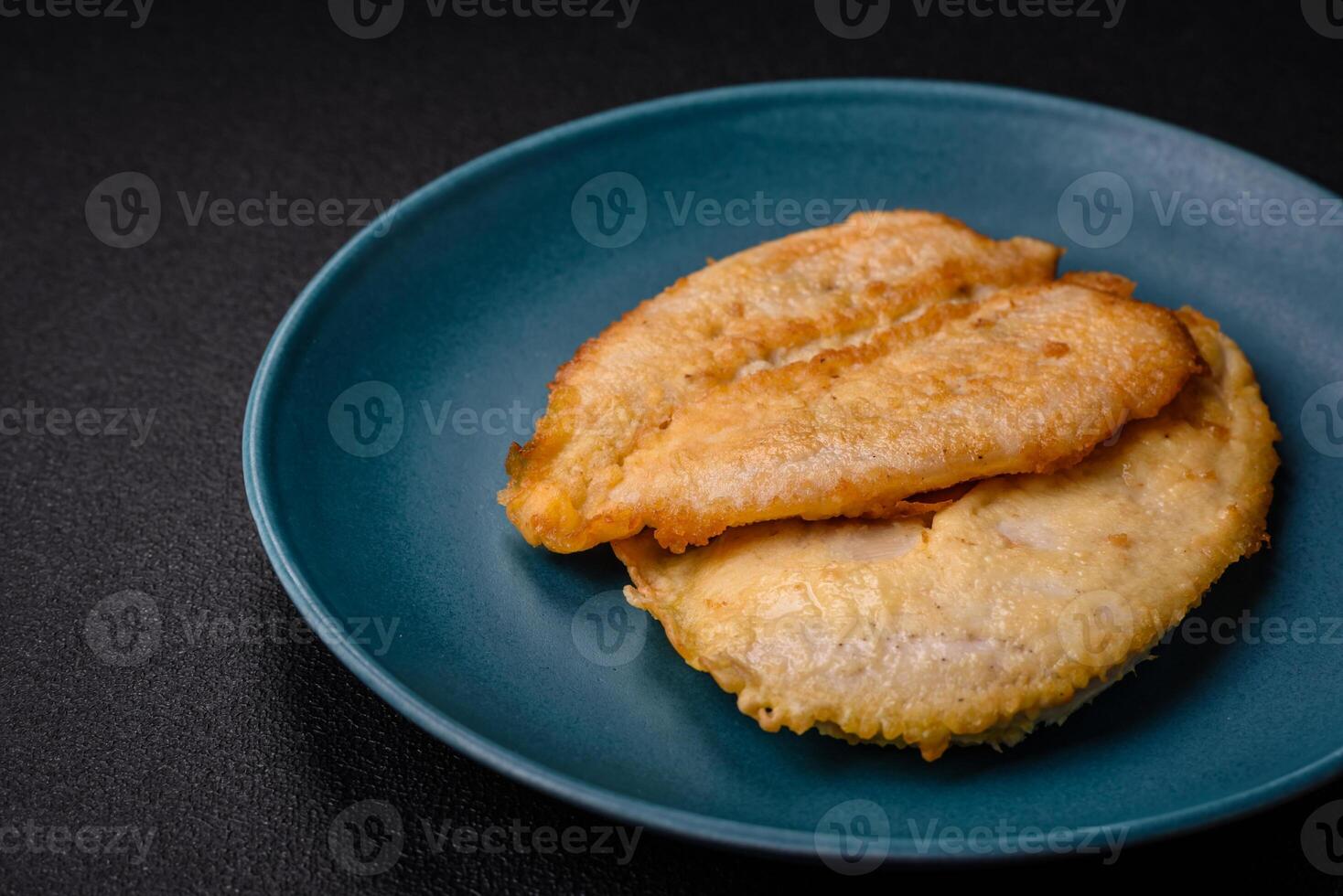 Delicious battered chicken breast chops with salt, spices and herbs photo