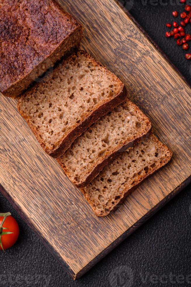 Delicious fresh crispy brown bread with seeds and grains photo