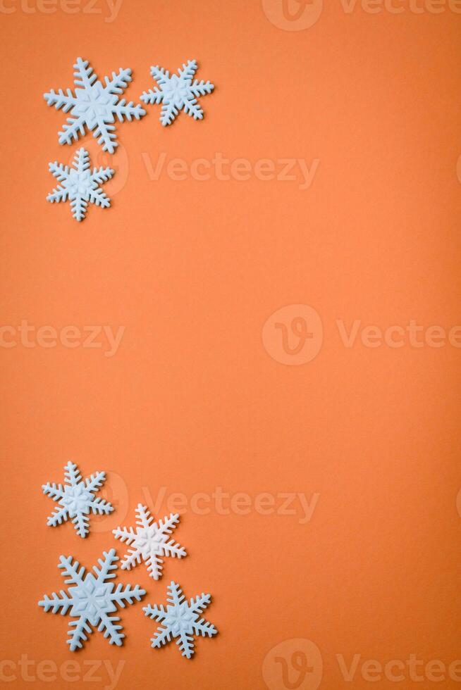 Beautiful winter snowflakes on a plain background with copy space photo