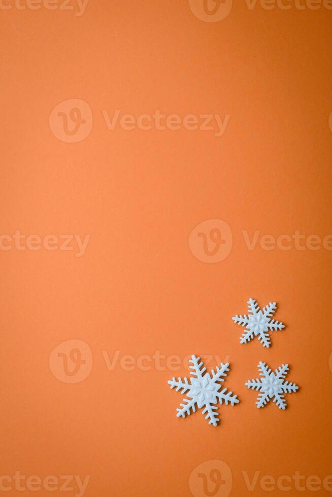 Beautiful winter snowflakes on a plain background with copy space photo