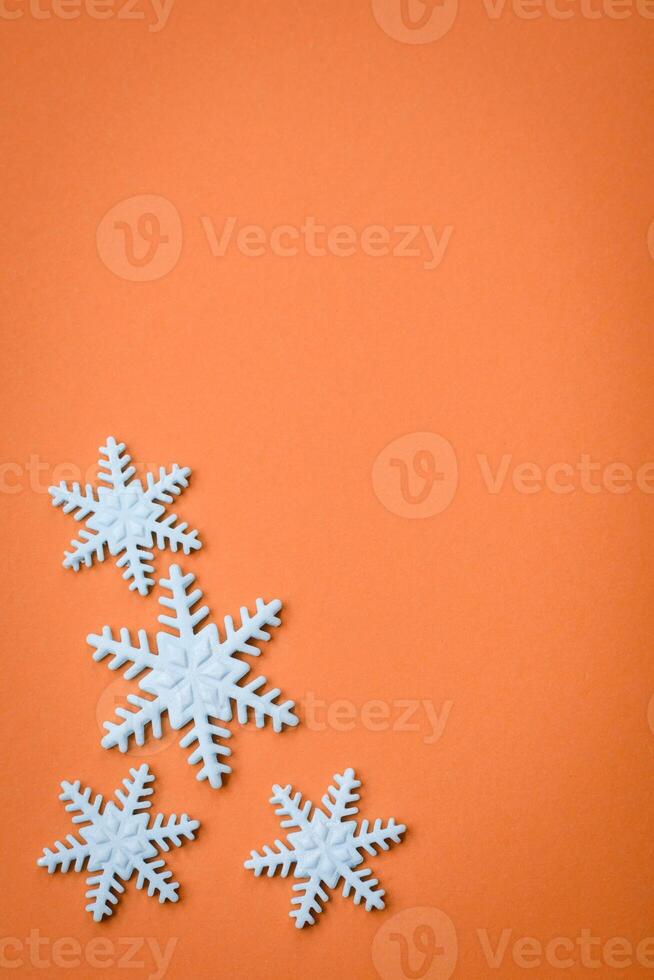 Beautiful winter snowflakes on a plain background with copy space photo