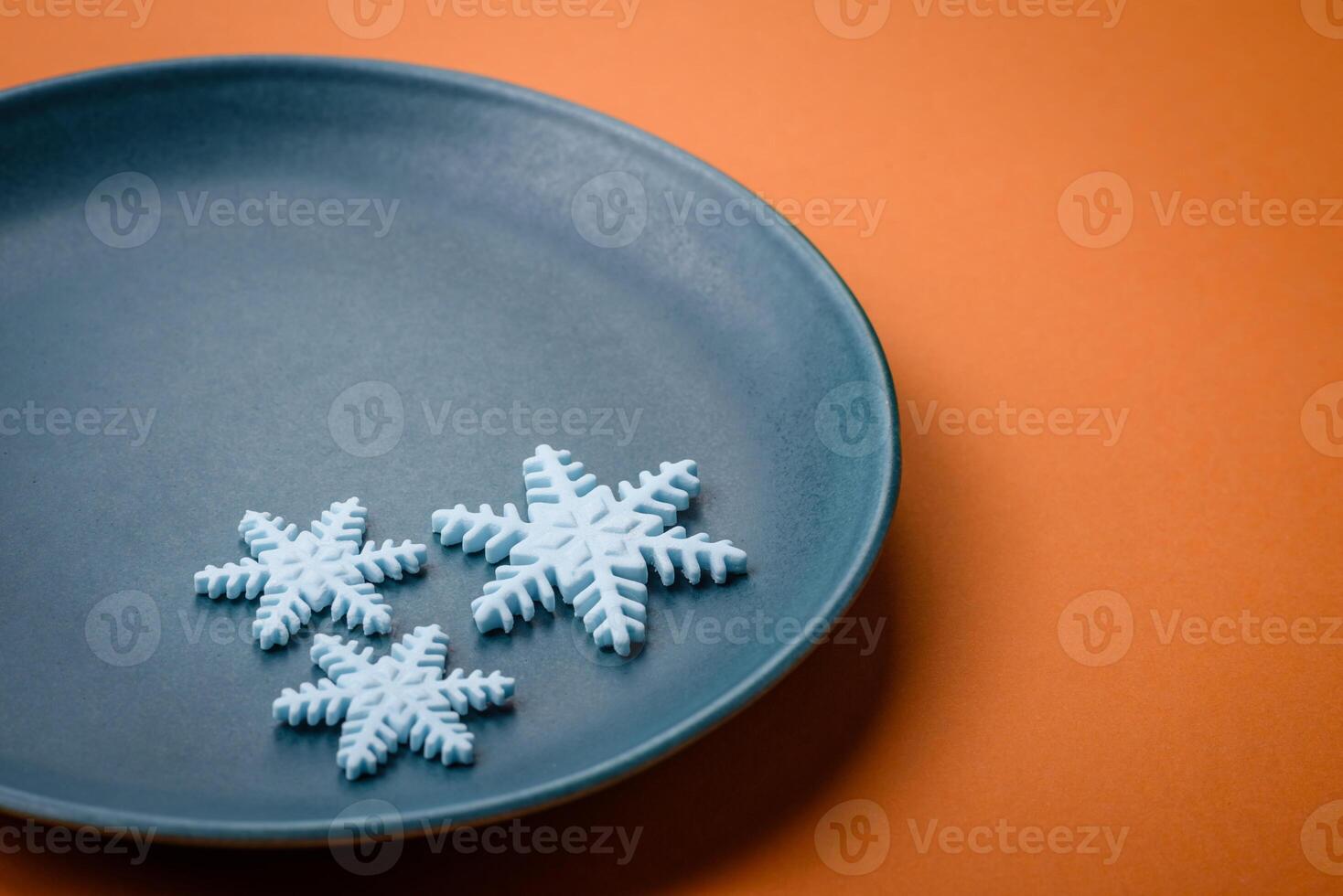 Beautiful winter snowflakes on a plain background with copy space photo