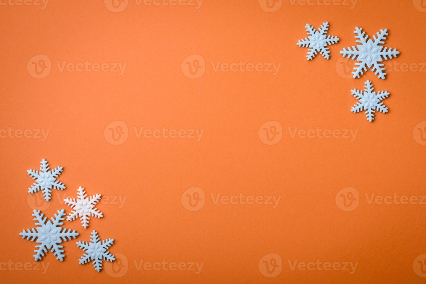 Beautiful winter snowflakes on a plain background with copy space photo